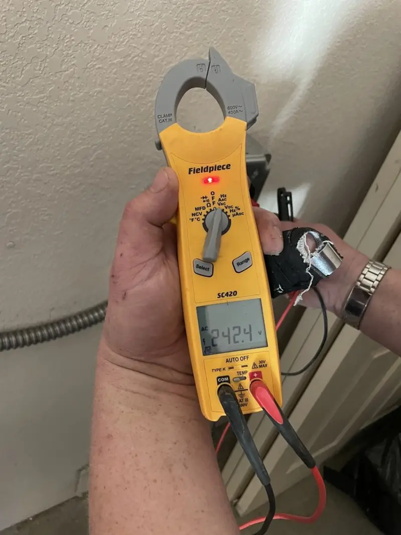Voltage testing with clamp meter during Electrical Installation Services in Sunset Beach